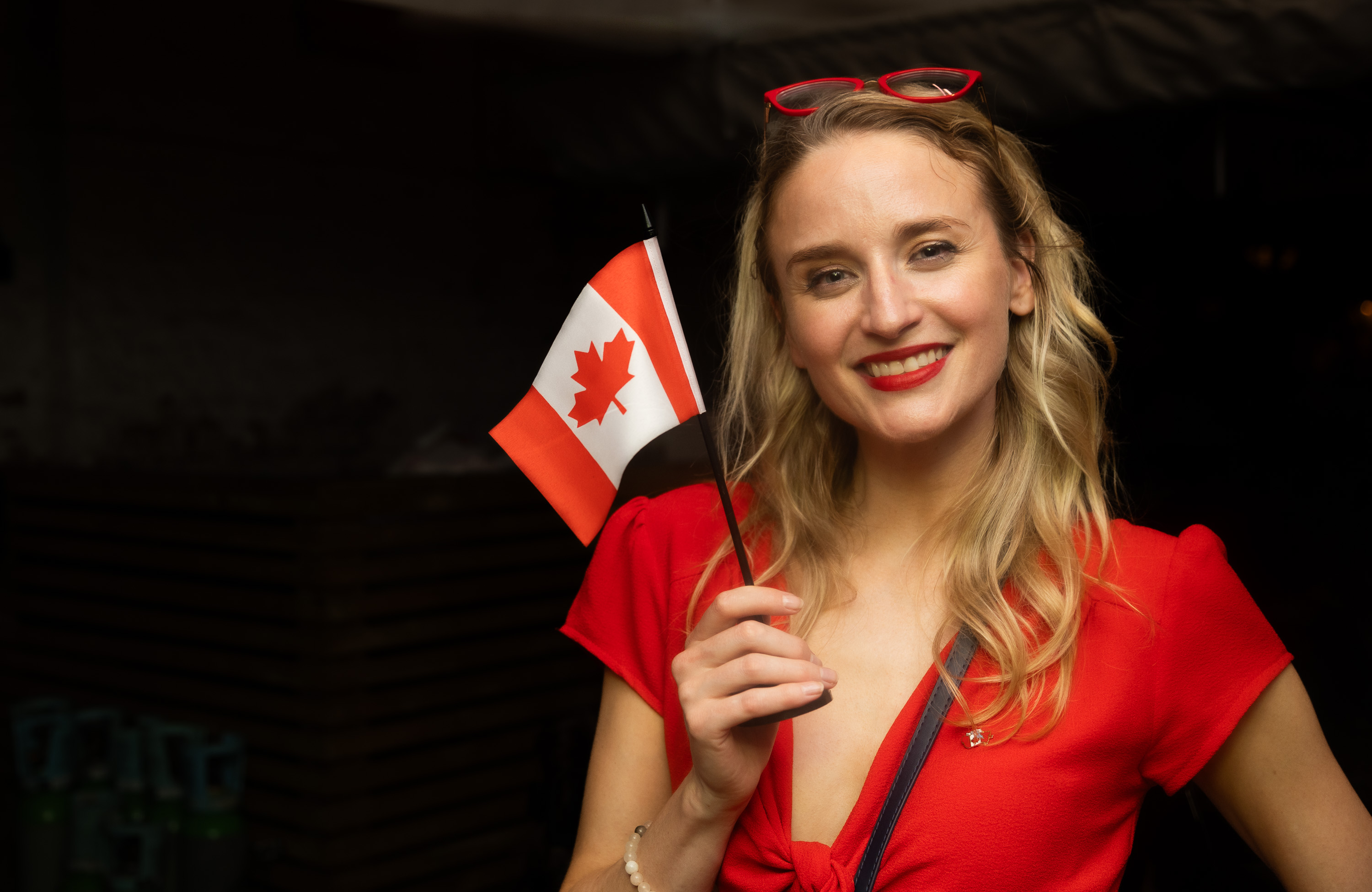 A CIL community member holding a Canadian flag